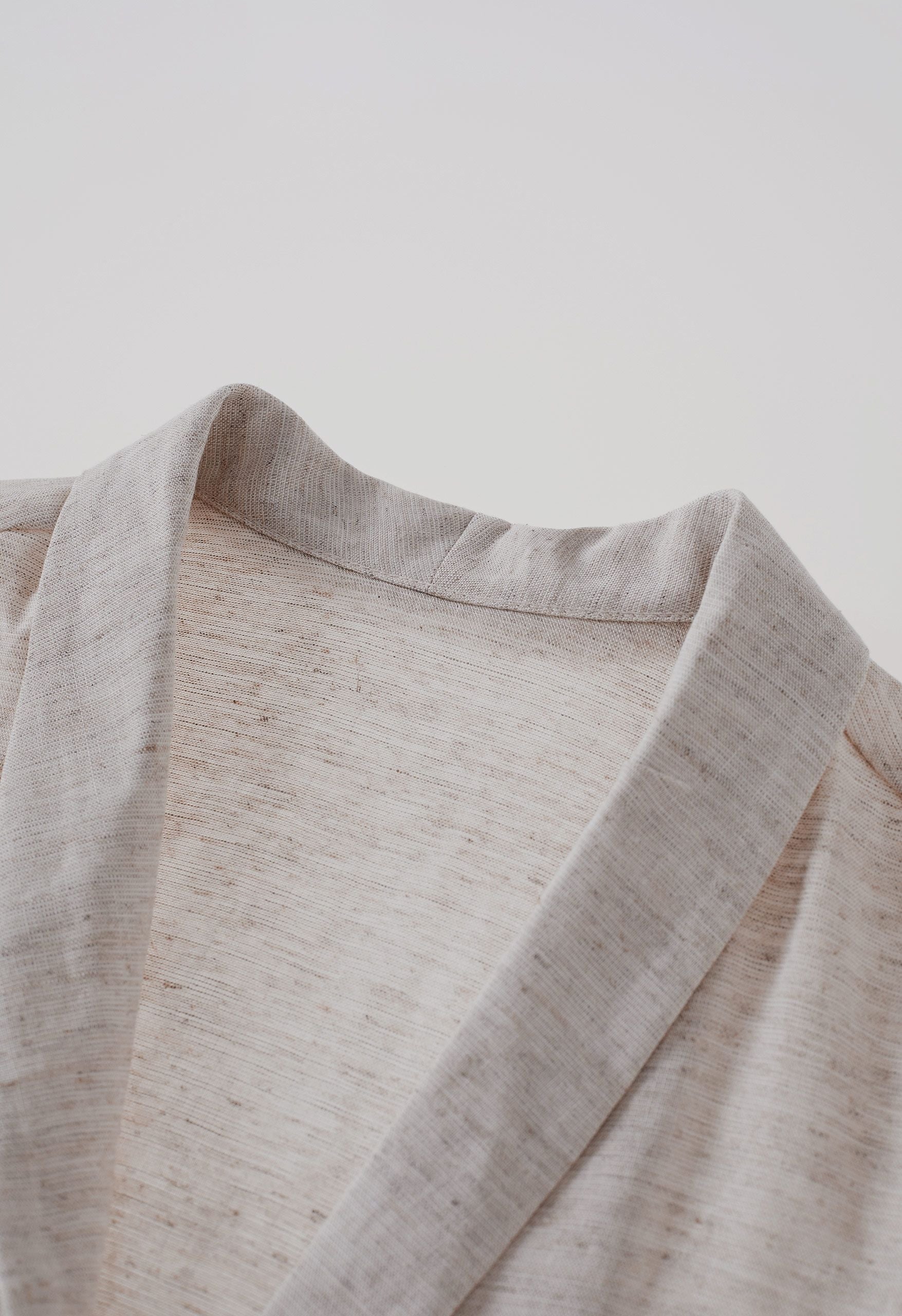 Elegant V-neck belted office top in breathable linen blend