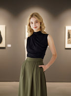 Women's black ruched sleeveless fitted blouse