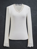 Elegant white bell sleeve blouse with delicate lace details