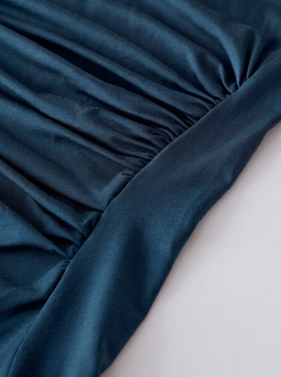 Slim-fit teal blouse with ruched front detail