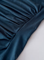 Slim-fit teal blouse with ruched front detail