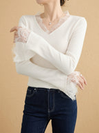 Women's white V-neck knit top with lace trim