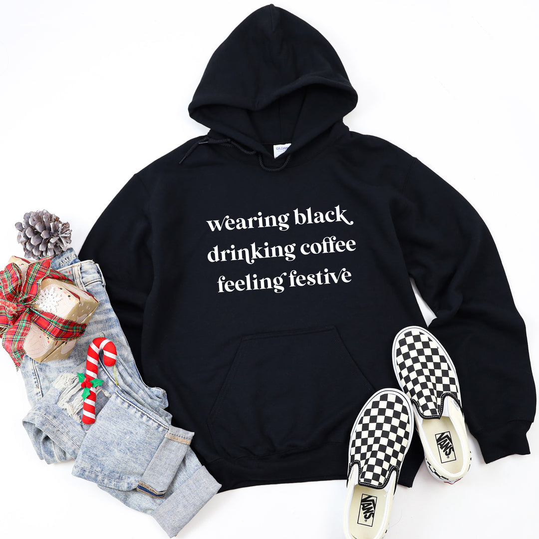 Wearing Black Drinking Coffee Feeling Festive Black Hoodie